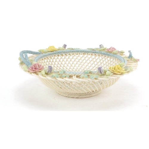 495 - Belleek first period floral encrusted pierced porcelain basket, 23cm in diameter