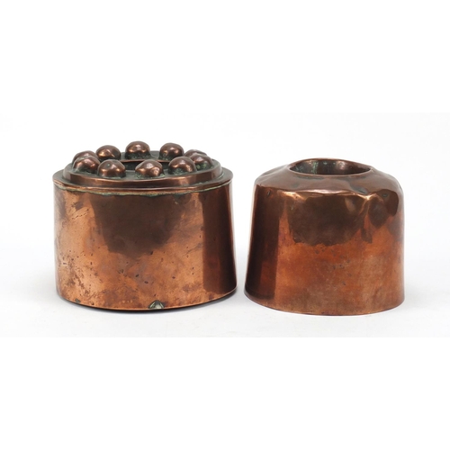 21 - Two 19th century copper jelly moulds, the largest 15cm in diameter