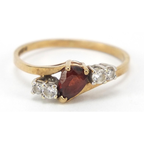 2369 - 9ct gold red and clear stone crossover ring, size N, 1.7g