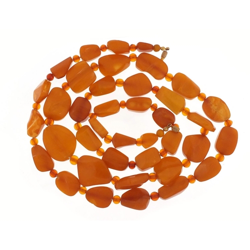 2365 - Butterscotch amber coloured bead necklace, 100cm in length, 71.2g