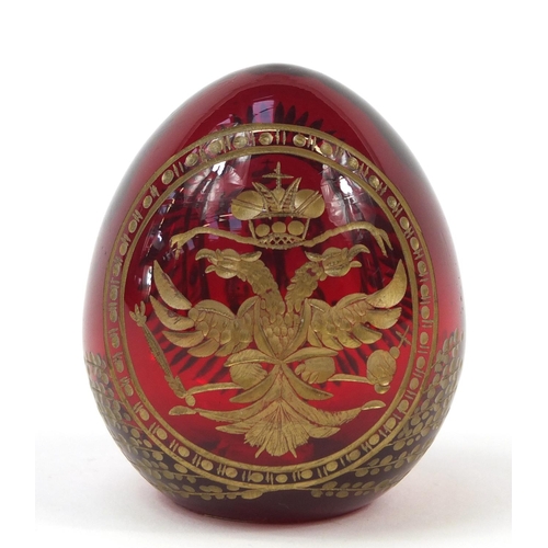 142 - Russian ruby glass egg in the style of Faberge, 6cm high