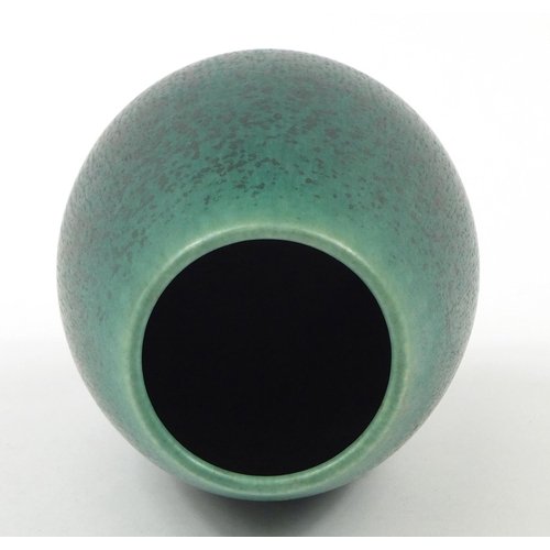 68 - Saxbo, Danish stoneware vase with stylised motif having a green mottled glaze, 13cm high