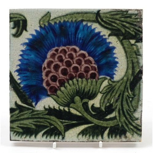 210 - William De Morgan, Arts & Crafts pottery BBB tile hand painted with a stylised thistle and foliage, ... 