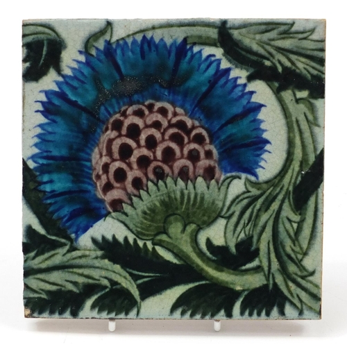 213 - William De Morgan, Arts & Crafts pottery BBB tile hand painted with a stylised thistle and foliage, ... 