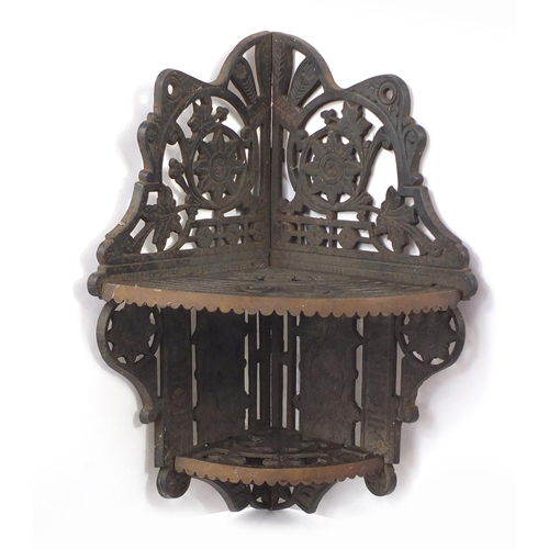 161 - Colebrookdale style cast iron hanging corner shelf cast with flowers, 40cm high