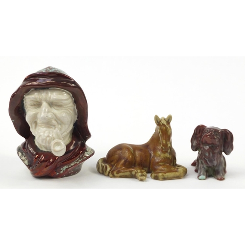 181 - Bornholm, two Danish stoneware animals and a bust of a pipe smoking gentleman having a lustre glaze,... 