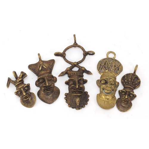 3782 - Five African Benin style brass pendants, the largest 10.5cm high