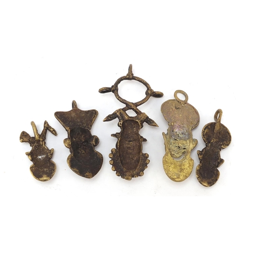 3782 - Five African Benin style brass pendants, the largest 10.5cm high