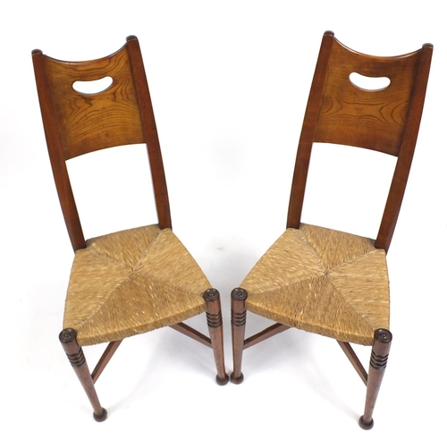1486A - Pair of Arts & Crafts elm side chairs with rush seats, 105cm high