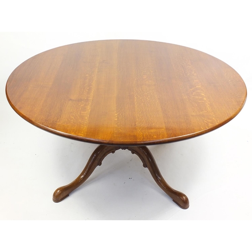1472 - Circular oak dining table and eight Lancashire spindle back chairs with rush seats, the table 75cm H... 