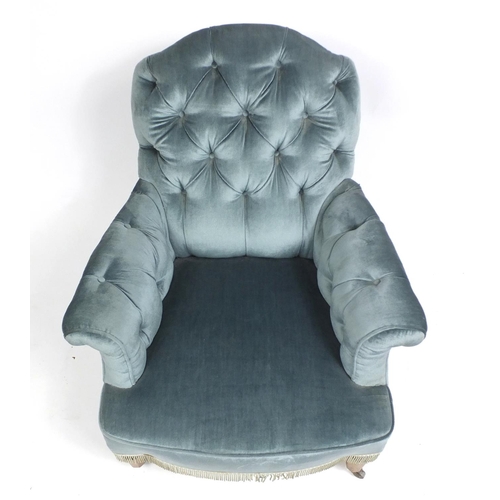 1547 - Blue button back upholstered chair on octagonal walnut tapering legs, 88cm high