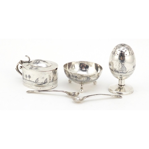 3085 - Egyptian silver niello work three piece cruet depicting temples and sailing boats, the largest 7cm h... 