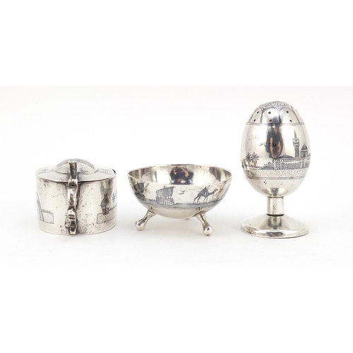 3085 - Egyptian silver niello work three piece cruet depicting temples and sailing boats, the largest 7cm h... 