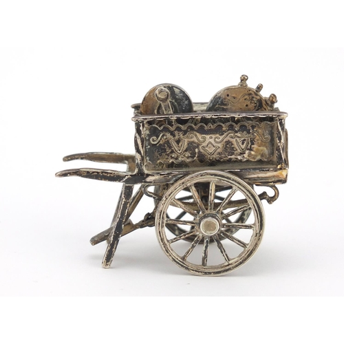 3042 - Medusa Oro, Italian miniature silver model of a knife sharpener's cart with moving parts, 6cm in len... 