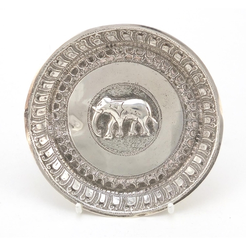 3079 - Burmese silver coloured metal dish embossed with a elephant, 11cm in diameter, 53.5g