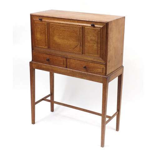 1480 - Arts & Crafts oak student's bureau on stand with a fall above two drawers, 109cm H x 79cm W x 33cm D