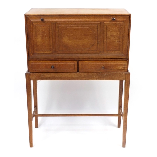 1480 - Arts & Crafts oak student's bureau on stand with a fall above two drawers, 109cm H x 79cm W x 33cm D