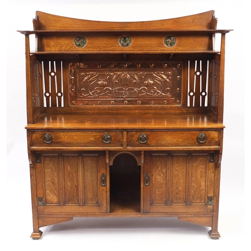 1450 - Liberty & Co, Arts & Crafts oak sideboard with embossed copper panels and Ruskin type cabochon round... 