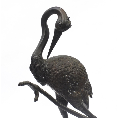 1487 - Floor standing patinated bronze stork, 138cm high