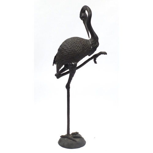 1487 - Floor standing patinated bronze stork, 138cm high