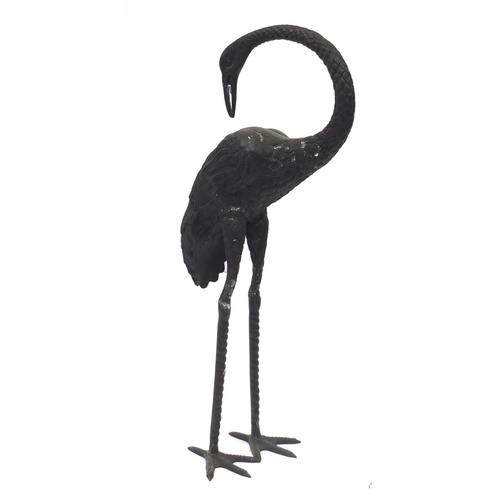 1489 - Floor standing patinated bronze stork, 83.5cm high