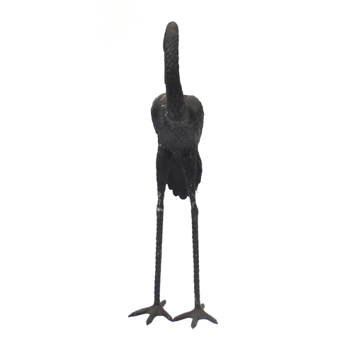 1489 - Floor standing patinated bronze stork, 83.5cm high