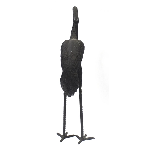 1489 - Floor standing patinated bronze stork, 83.5cm high