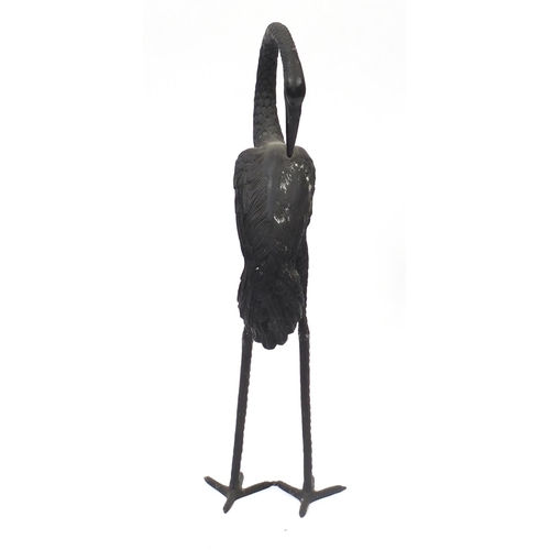 1488 - Floor standing patinated bronze stork, 83.5cm high