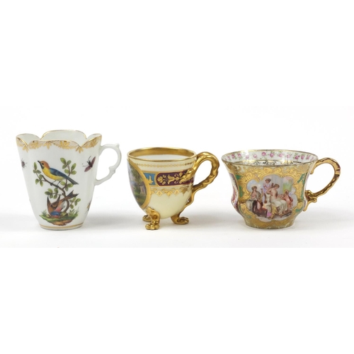 98 - Continental porcelain including a hand painted Augustus Rex cup and a Vienna style cup with paw feet... 