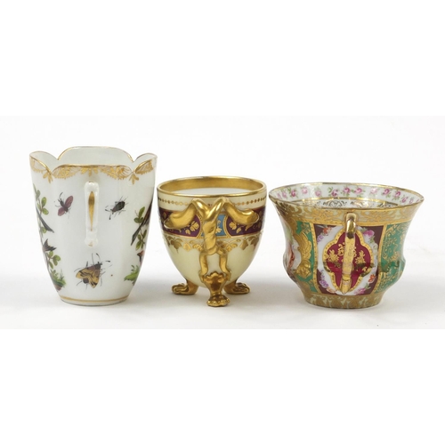 98 - Continental porcelain including a hand painted Augustus Rex cup and a Vienna style cup with paw feet... 