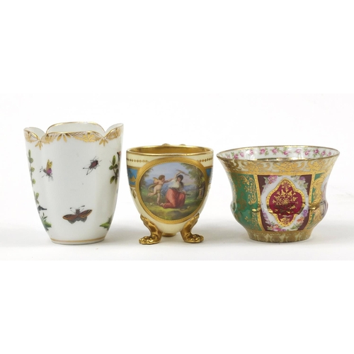 98 - Continental porcelain including a hand painted Augustus Rex cup and a Vienna style cup with paw feet... 