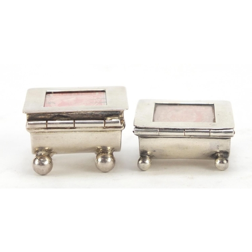 3060 - Two Victorian and later silver stamp boxes with hinged lids, each raised on four ball feet, Birmingh... 