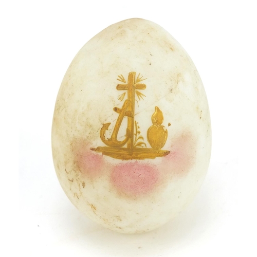 143 - Russian egg in the style of Fabergé gilded with a cross, 6.3cm high