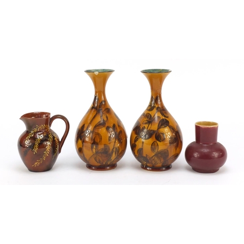 60 - Linthorpe, Arts & Crafts Pottery in the manner of Christopher Dresser comprising a pair of vases, ju... 