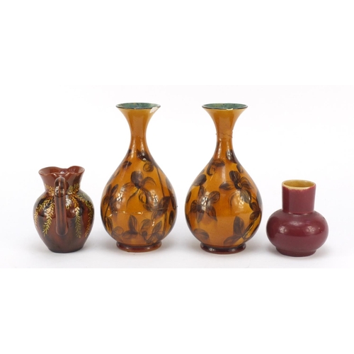 60 - Linthorpe, Arts & Crafts Pottery in the manner of Christopher Dresser comprising a pair of vases, ju... 