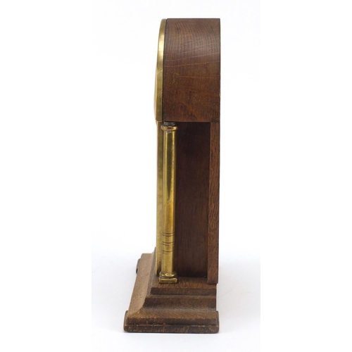 33 - Oak and brass Secessionist mantle clock with columns, 23cm high