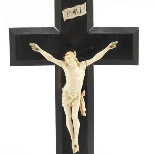26 - 19th century carved ivory Corpus Christi on ebonised crucifix, 27.5cm high