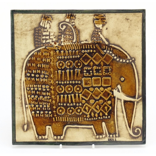 79 - Lisa Larson for Gustavsberg, Swedish ceramic tile hand painted with three stylised figures on elepha... 