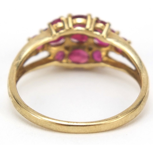 2335 - 9ct gold ruby and diamond cluster ring, size O, 2.4g