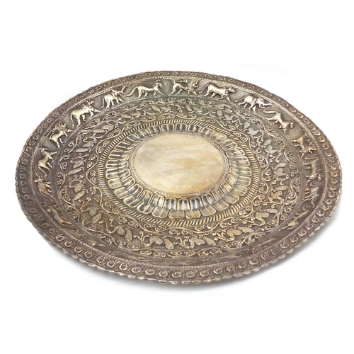 3076 - Burmese silver coloured metal tray embossed with birds of Paradise and wild animals amongst foliage,... 