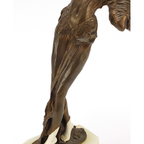 164 - Large French Art Deco bronze and ivory figurine of a scantily dressed female, raised on a shaped ony... 