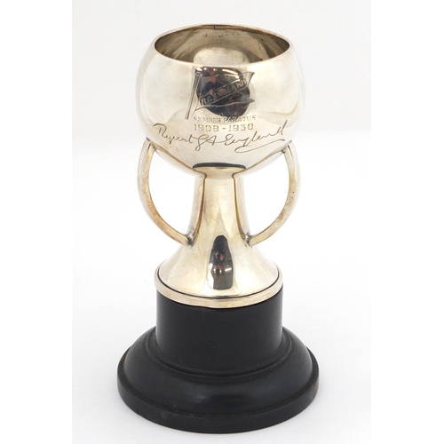 3038 - Arts & Crafts silver trophy with R.G. England inscription, raised on an ebonised stand, London 1869,... 