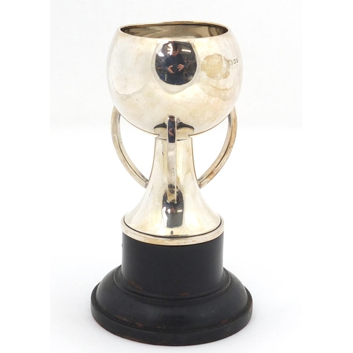 3038 - Arts & Crafts silver trophy with R.G. England inscription, raised on an ebonised stand, London 1869,... 