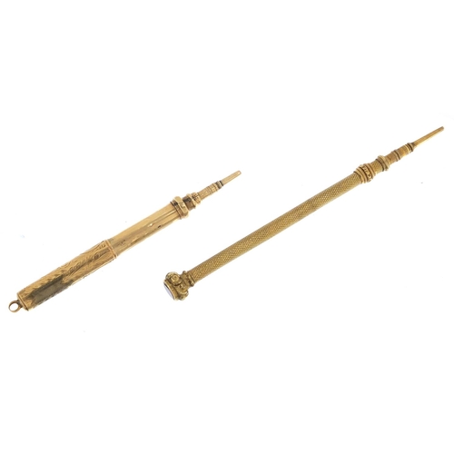 880 - 9ct gold propelling pencil and a gold coloured metal example, the largest 7.5cm in length, 12.2g