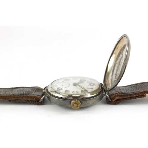 2405 - Military interest wristwatch with luminous dial and case by George Stockwell, 34mm in diameter