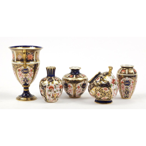 94 - Royal Crown Derby Old Imari comprising a trophy vase, scuttle and three other vases, the largest 12.... 