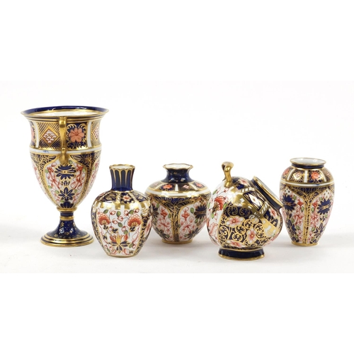 94 - Royal Crown Derby Old Imari comprising a trophy vase, scuttle and three other vases, the largest 12.... 