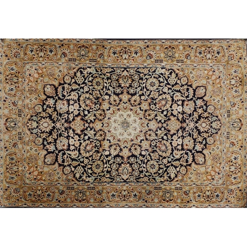 1495 - Rectangular Persian Qum silk rug having all over stylised floral design onto midnight blue and beige... 