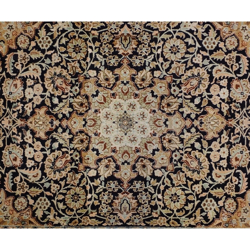 1495 - Rectangular Persian Qum silk rug having all over stylised floral design onto midnight blue and beige... 