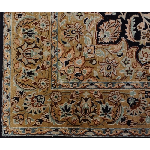 1495 - Rectangular Persian Qum silk rug having all over stylised floral design onto midnight blue and beige... 